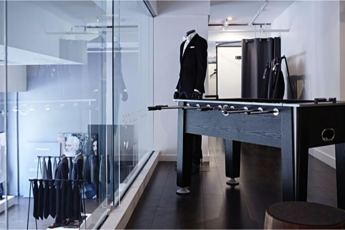 The interior of an INDOCHINO showroom featuring a game table.